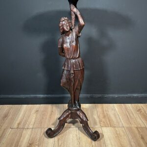 carved wooden tripod